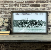 Framed reproduction photo of the 1916 Iowa vs. Nebraska football game, sold at Thistles in Pella, Iowa
