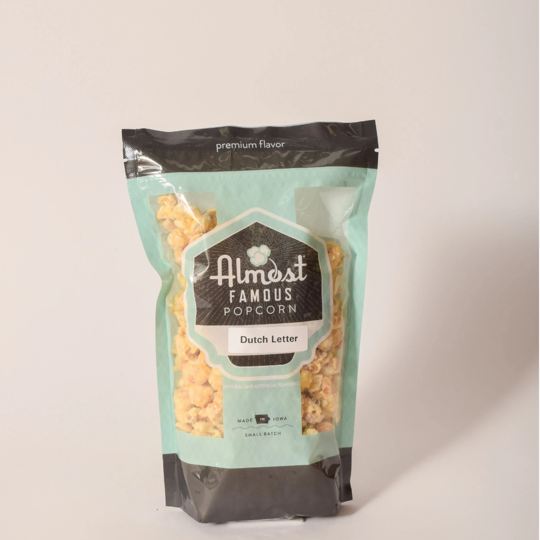 Bag of Dutch Letter flavored popcorn inspired by Pella's pastry tradition, sold at Thistles in Pella, Iowa