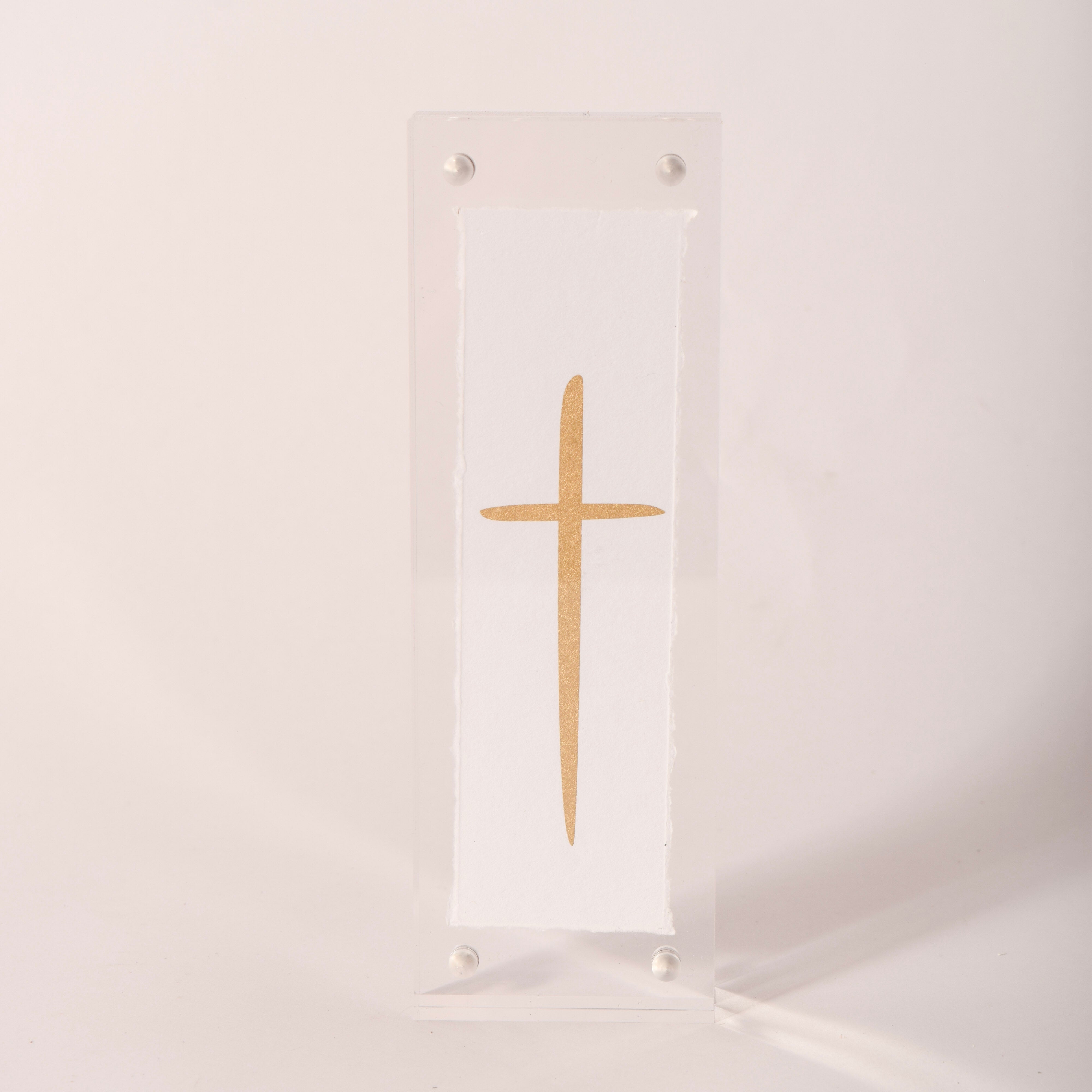 Clear acrylic rectangle with a gold-embossed cross design, sold at Thistles in Pella, Iowa