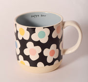 Black and white floral ceramic mug with "Happy Hour" printed inside, sold at Thistles in Pella, Iowa