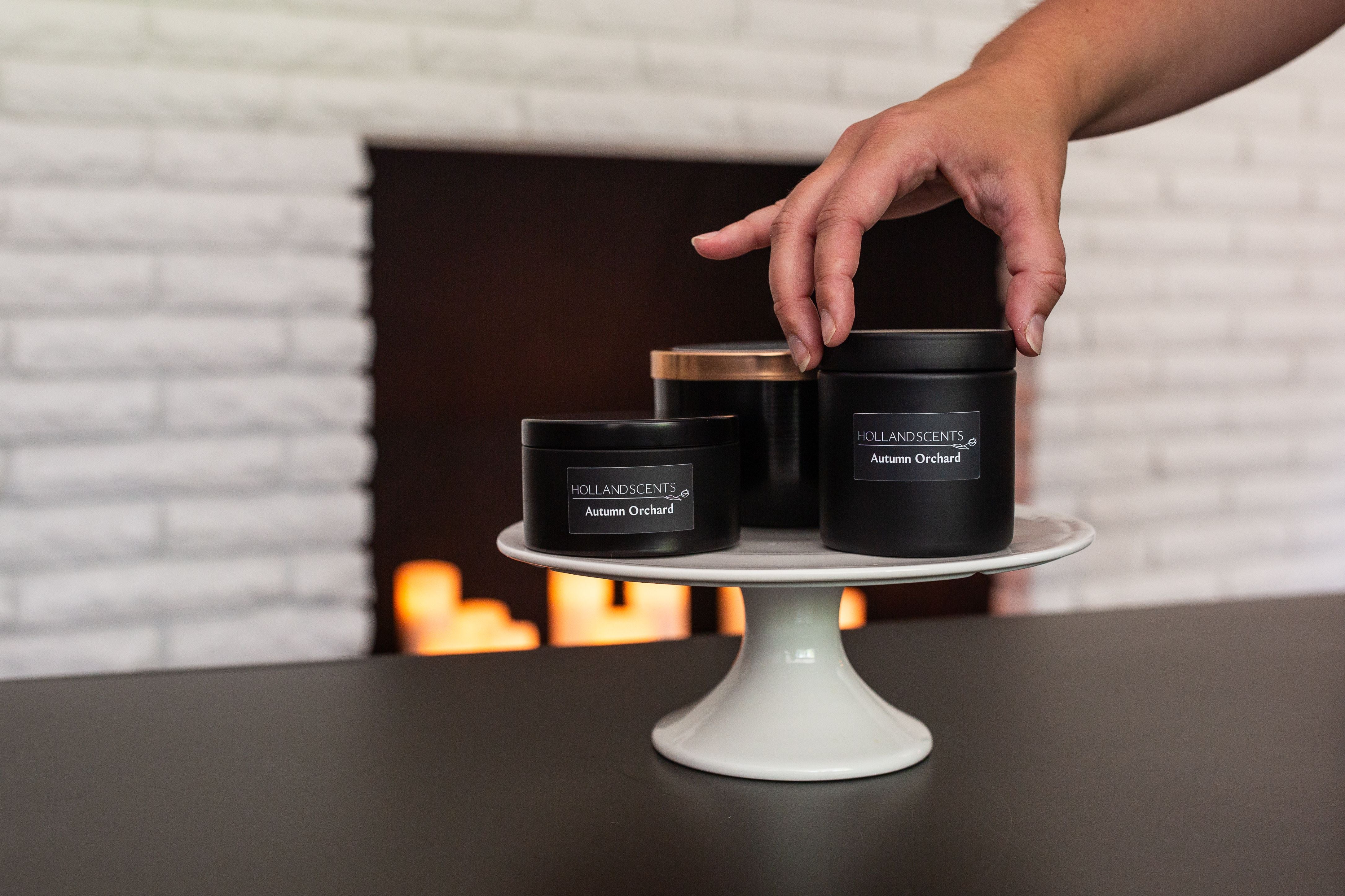 Holland Scents Autumn Orchard soy candle in three sizes displayed on a cake stand, Pella, Iowa