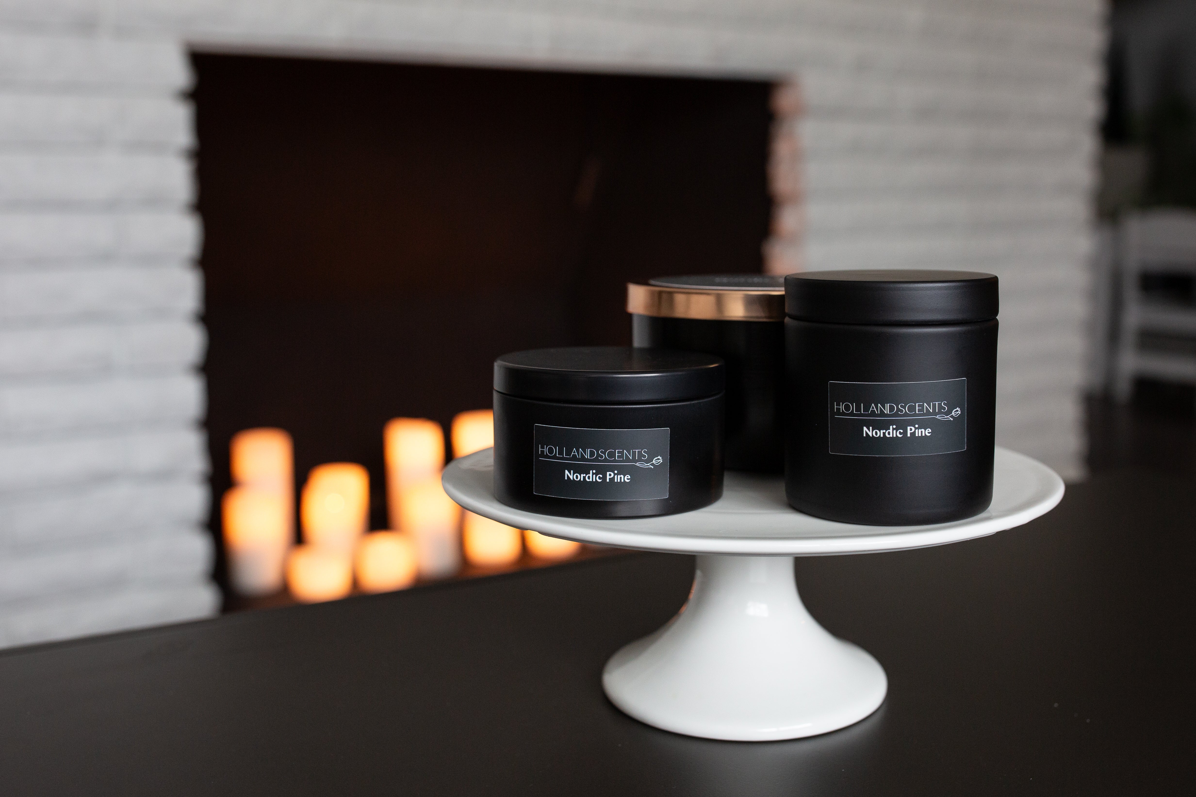 Holland Scents Nordic Pine soy candle held outdoors at a Christmas tree farm, Pella, Iowa