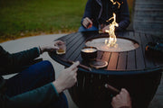Holland Scents Opa soy candle on an outdoor fire pit table with cigars and whiskey, Pella, Iowa