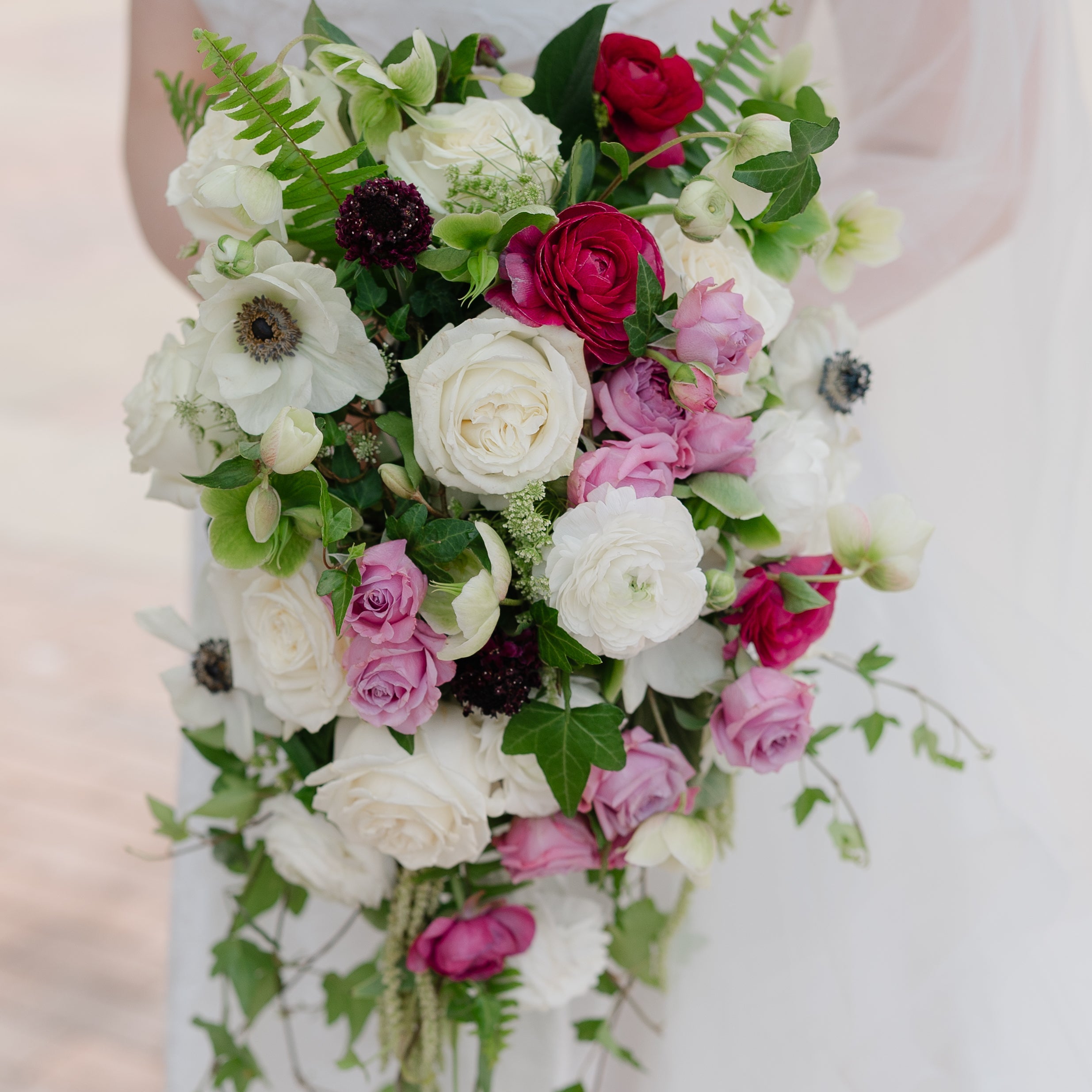 Cascading bridal bouquet with white, pink, and green flowers, Pella, Iowa