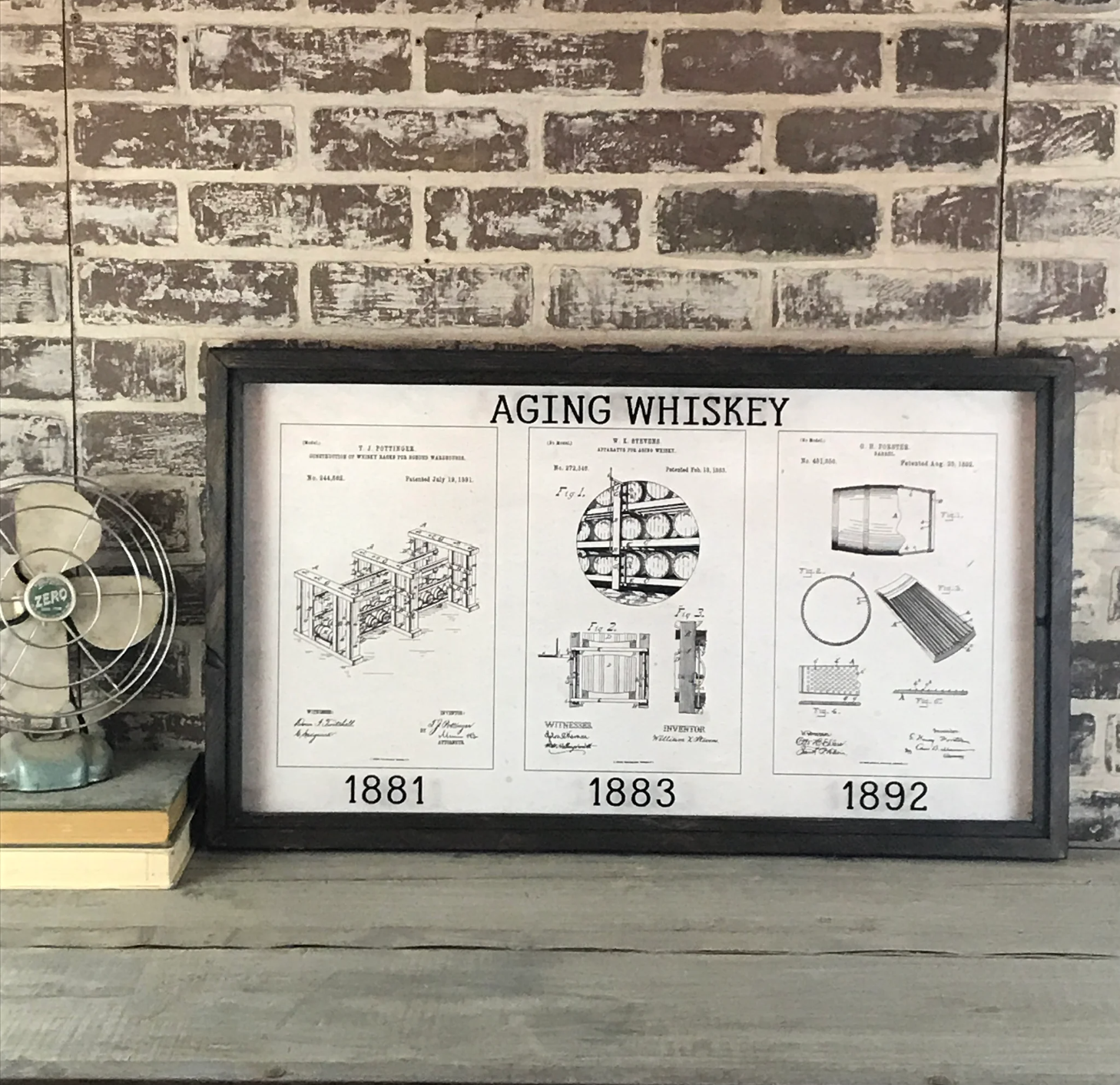 Framed trio of whiskey aging patent illustrations, sold at Thistles in Pella, Iowa